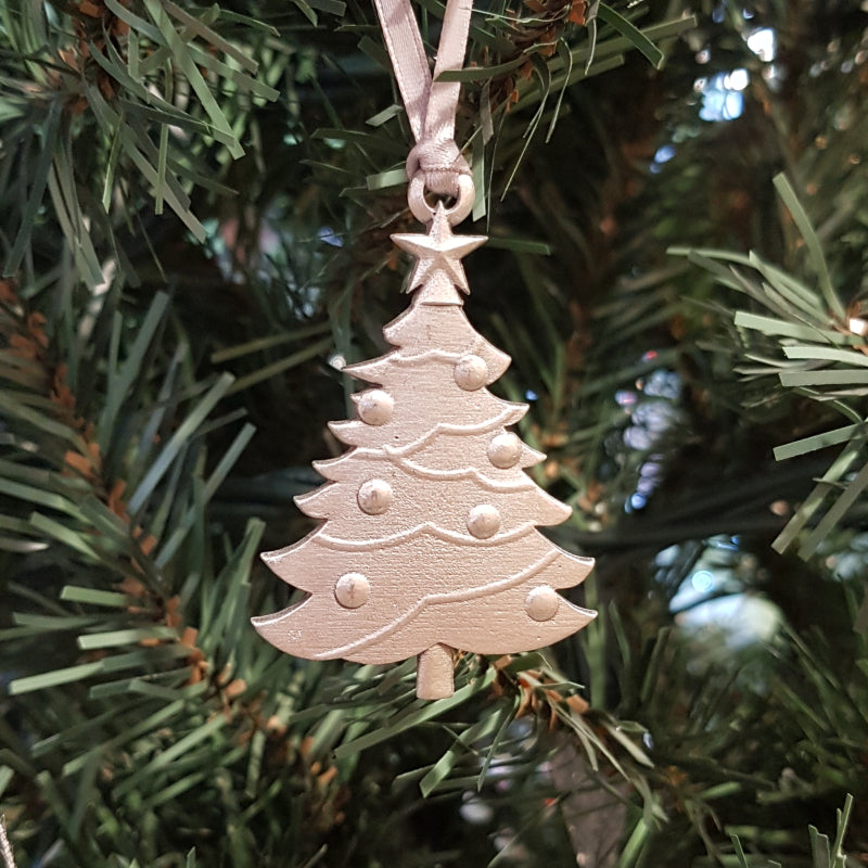 pewter tree ornament on christmas tree