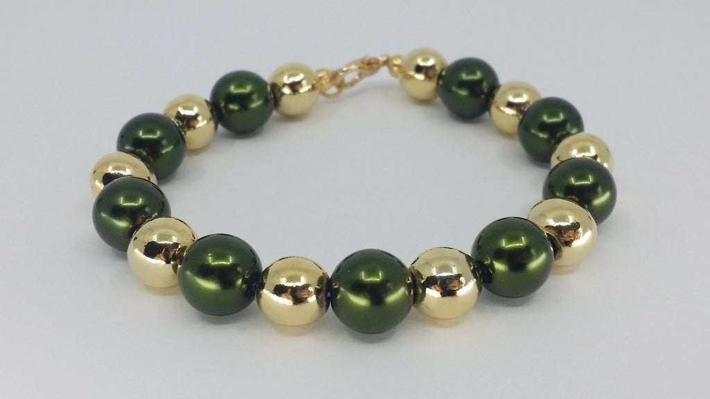 gold plated pewter pearl bracelet with green painted glass beads. Green Bay Packers. Saint Patrick's Day. Handmade. Canadian.
