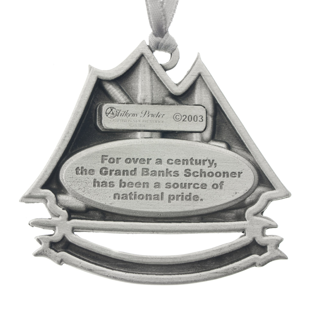 Bluenose schooner on the water, above a banner reading "Halifax, NS." Christmas Tree ornament. Made from Pewter. Silver ribbon. Made in Fredericton NB New Brunswick Canada