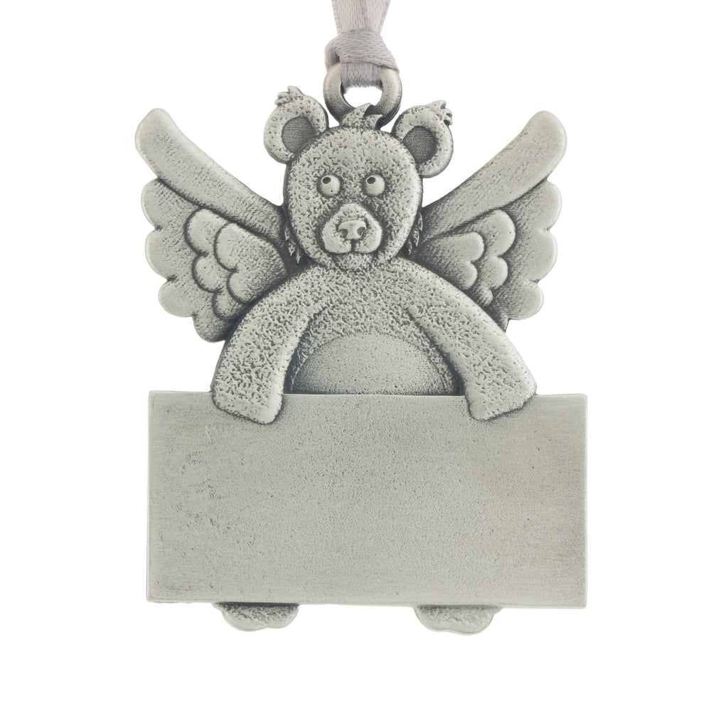 Teddy bear with angel wings holding an engravable sign. Christmas Tree ornament. Made from Pewter. Silver ribbon. Made in Fredericton NB New Brunswick Canada