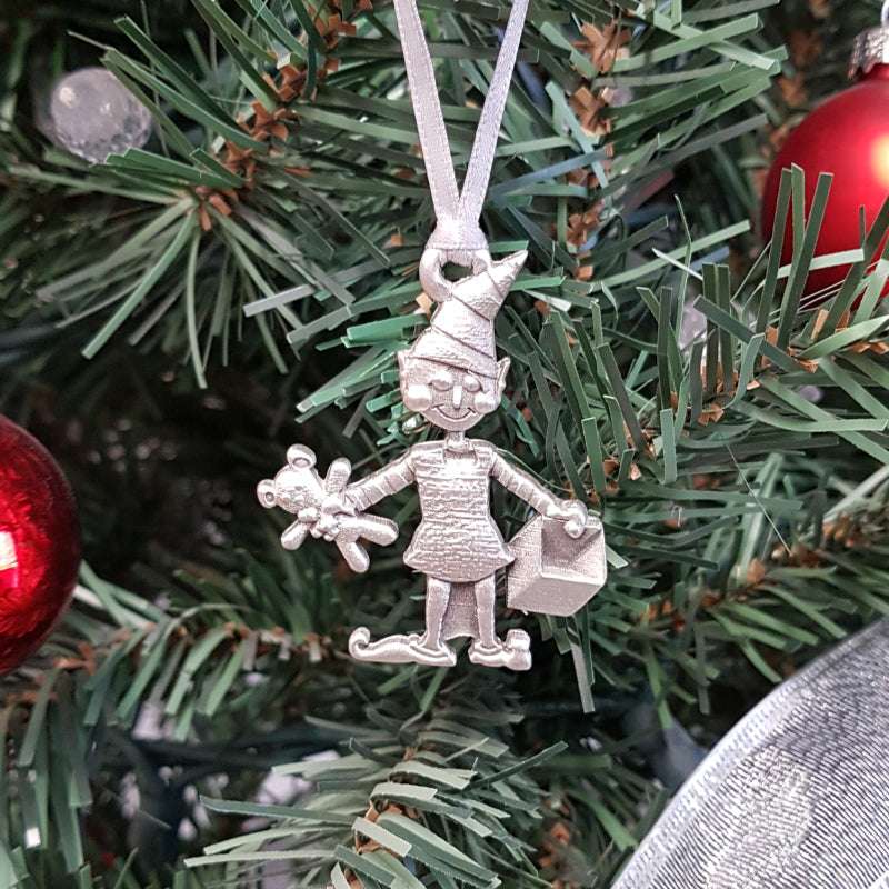pewter elf ornament on christmas tree
