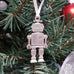 pewter robot ornament on christmas tree
