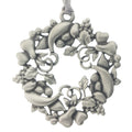 A holiday wreath fashioned from festive fruits. Christmas Tree ornament. Made from Pewter. Silver ribbon. Made in Fredericton NB New Brunswick Canada