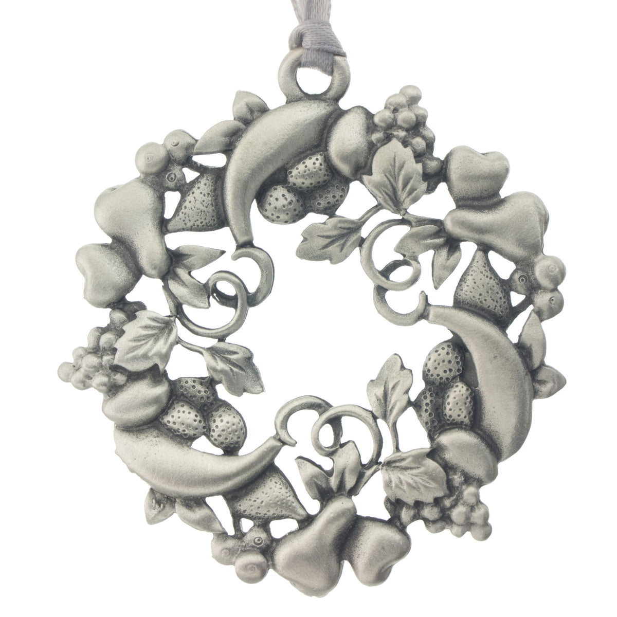 A holiday wreath fashioned from festive fruits. Christmas Tree ornament. Made from Pewter. Silver ribbon. Made in Fredericton NB New Brunswick Canada
