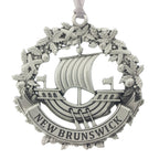 The NB galley inset in a wreath, and a New Brunswick Banner. Christmas Tree ornament. Made from Pewter. Silver ribbon. Made in Fredericton NB Canada