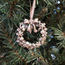 pewter holly wreath ornament on christmas tree