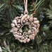 pewter holiday fruit wreath ornament on christmas tree
