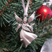pewter angel ornament on christmas tree