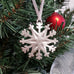 pewter snowflake ornament on christmas tree