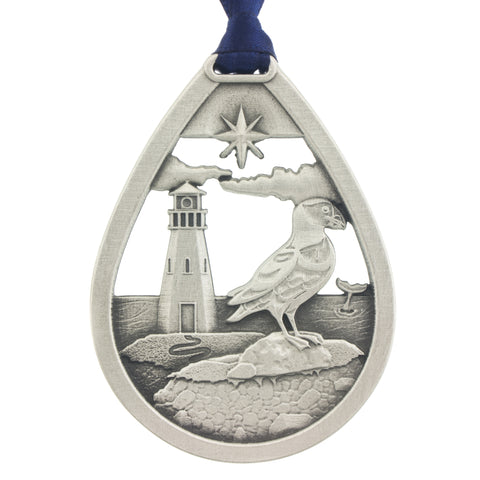 Atlantic Memories. Puffin. Lighthouse. Whale. Maritimes. Ocean. 2010. Christmas Tree ornament. Made from Pewter. Blue ribbon. Made in Fredericton NB New Brunswick Canada