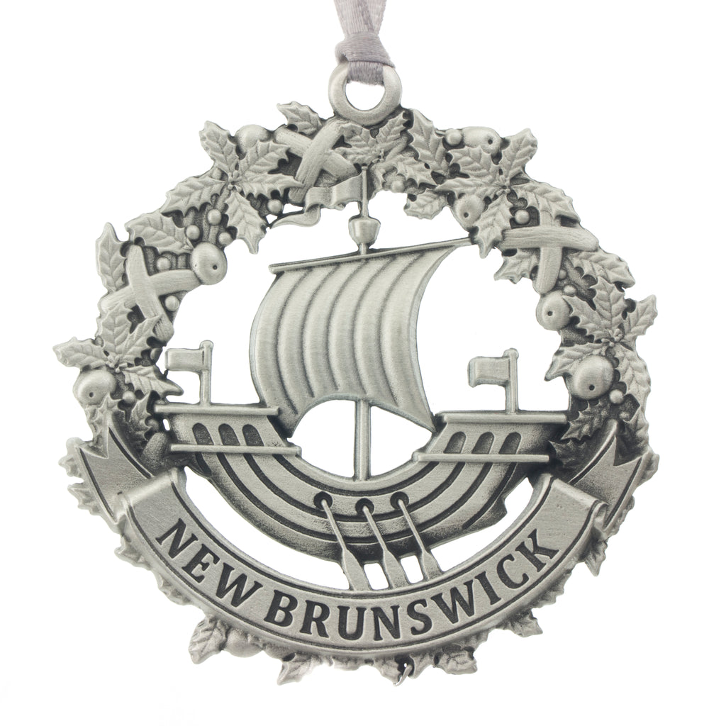 The NB galley inset in a wreath, and a New Brunswick Banner. Christmas Tree ornament. Made from Pewter. Silver ribbon. Made in Fredericton NB Canada
