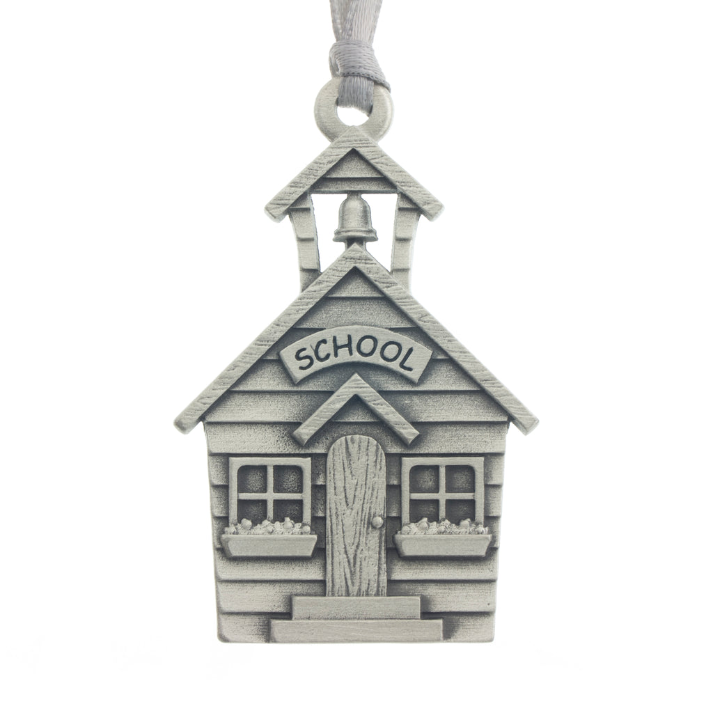 An inviting one room school house Christmas Tree ornament. Made from Pewter. Silver ribbon. Made in Fredericton NB New Brunswick Canada