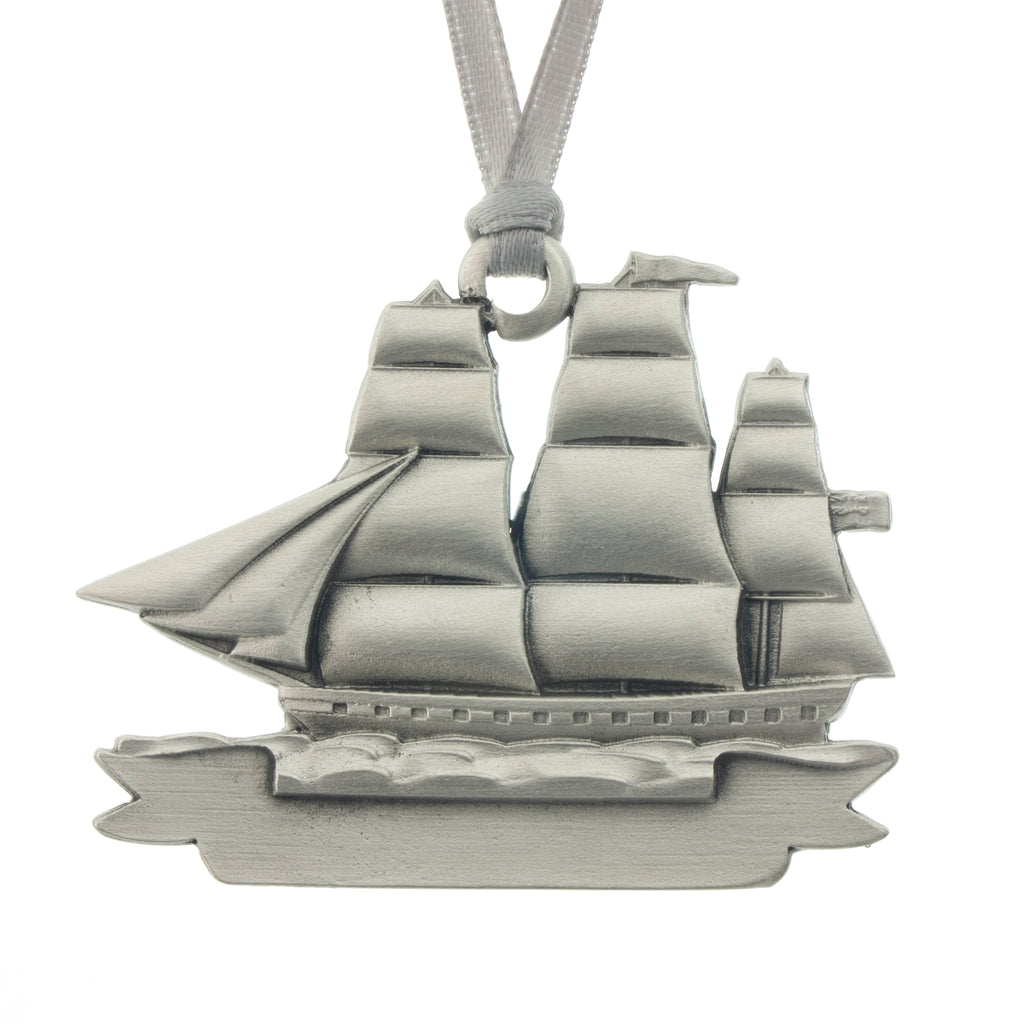 An adventurous tall masted clipper ship with full sails. Christmas Tree ornament. Made from Pewter. Silver ribbon. Made in Fredericton NB New Brunswick Canada